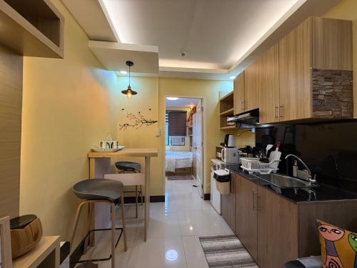 a kitchen with a sink and a counter top at Elly's Place in Quezon City