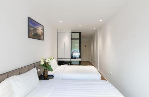 Katil atau katil-katil dalam bilik di Better Home Hanoi