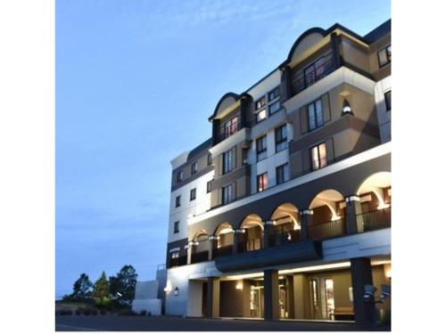 a rendering of a building with lights on at Furano Hops Hotel - Vacation STAY 41796v in Kami-furano