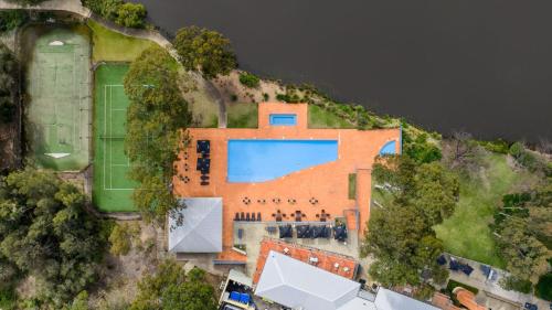 an aerial view of a house with a swimming pool at Golf & Wine Country Villa Cypress in Pokolbin