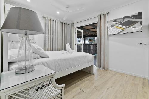 Ένα ή περισσότερα κρεβάτια σε δωμάτιο στο Bribie Island Sands - by the jetty