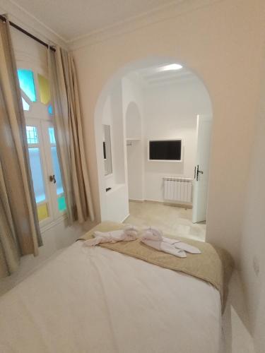 Katil atau katil-katil dalam bilik di Hôtel Al Jazira Mahdia