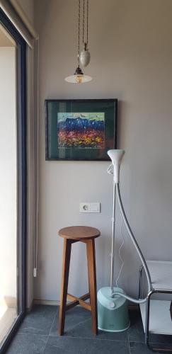 a lamp and a table in a room with a painting at Calm Lux 3 BR 2 Baths next to AEON Mall in Cilandak