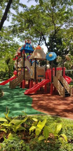 a playground in a park with a slide at Calm Lux 3 BR 2 Baths next to AEON Mall in Cilandak
