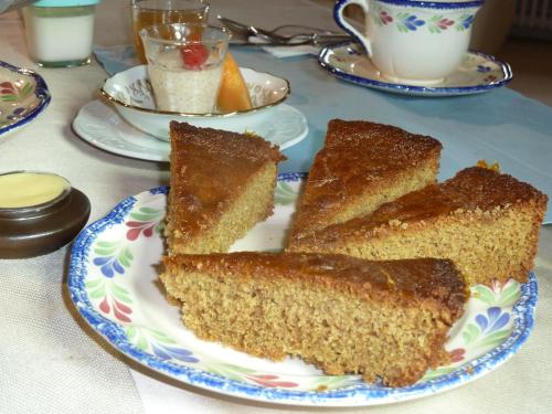 a plate with three slices of cake on a table at Les Bruyères du Mont in Céaux