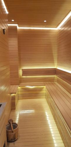 a sauna with a bucket in the middle of it at Calm Lux 3 BR 2 Baths next to AEON Mall in Cilandak