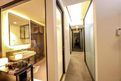 a bathroom with a sink and a mirror at Calm Lux 3 BR 2 Baths next to AEON Mall in Cilandak