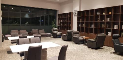 a library with chairs and tables in a room at Calm Lux 3 BR 2 Baths next to AEON Mall in Cilandak