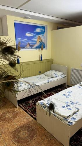 Ένα ή περισσότερα κρεβάτια σε δωμάτιο στο Mang’o Hostel