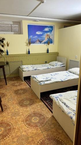 Ένα ή περισσότερα κρεβάτια σε δωμάτιο στο Mang’o Hostel