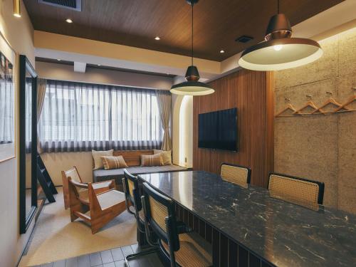 a conference room with a large table and chairs at illi Mani Shibuya in Tokyo