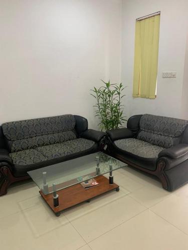 a living room with two couches and a coffee table at R&R residencies in Mount Lavinia