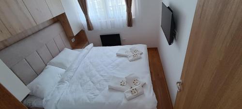 Postel nebo postele na pokoji v ubytování Apartman NIT Zlatibor