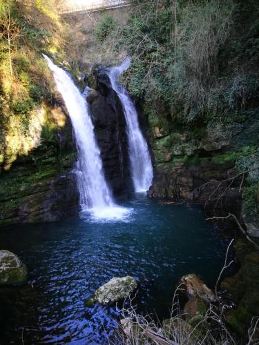 a waterfall in the middle of a body of water at Affaccio sulla Piazza Carpinone in Carpinone