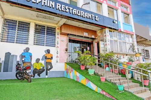 Gallery image of Hotel O Daffodil Lodge Dolphin restaurant in Jānla