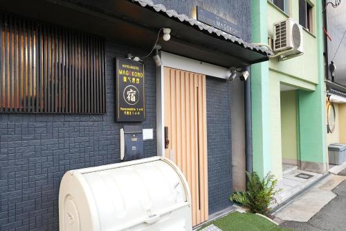 a white appliance sitting outside of a building at NAMBA STAY 302 新今宮 Shiimamiya in Osaka