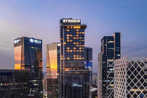 a group of tall buildings in a city at night at The St. Regis Shenzhen Bao'an in Shenzhen