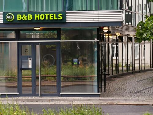 a building with a sign that says bbb hotels at B&B HOTEL Berlin-Mitte in Berlin