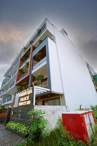 a building with a sign on the side of it at Hotel Maharaja Palace Boutique Hotels Near Medanta Medicity Gurgaon in Gurgaon