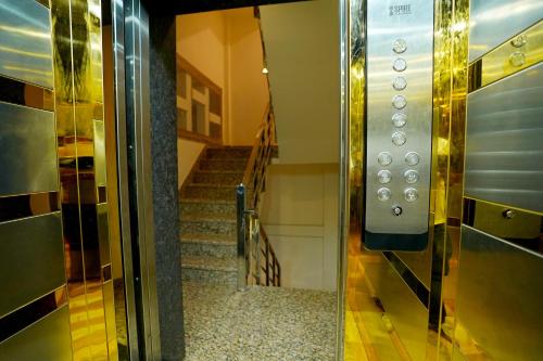 an elevator door with a staircase in a building at Hotel Maharaja Palace Boutique Hotels Near Medanta Medicity Gurgaon in Gurgaon