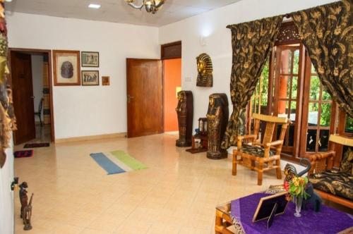 a living room with a couch and a table at The Kingston Court in Kandy
