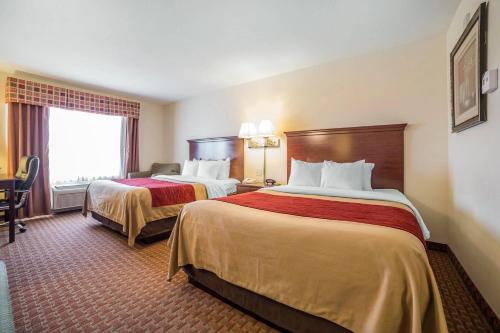 a hotel room with two beds and a window at Comfort Inn & Suites Rock Springs-Green River in Rock Springs