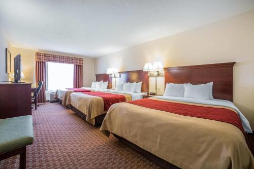 a hotel room with two beds and a window at Comfort Inn & Suites Rock Springs-Green River in Rock Springs