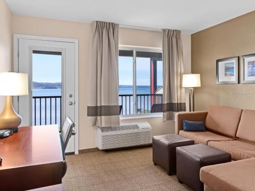 a living room with a couch and a table at Comfort Inn & Suites Munising-Lakefront in Munising