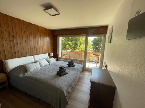 Ένα ή περισσότερα κρεβάτια σε δωμάτιο στο Appartement spacieux idéalement situé