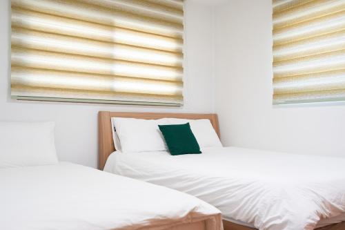 Postel nebo postele na pokoji v ubytování Haevichi Private Pension