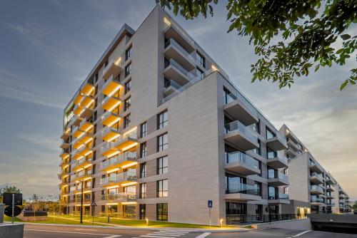 an architectural rendering of a white apartment building at ONE66 - Luxury Aparthotel in Braşov