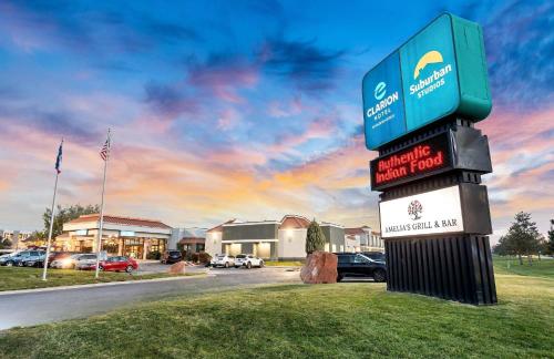 a street sign in front of a building with cars at Clarion Inn Salt Lake City Airport in Salt Lake City