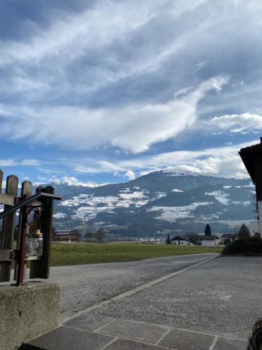 a view of a mountain from a parking lot at Wiesenblick Mils in Mils bei Hall