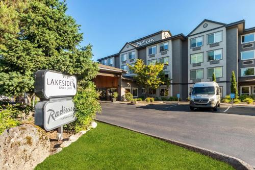 a van is parked in front of a building at Radisson Hotel Portland Airport in Portland