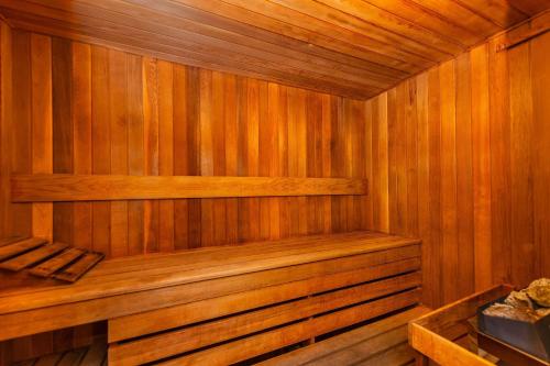a wooden sauna with a bench in the middle at Grand Park Hotel & Suites Downtown Vancouver, an Ascend Collection Hotel in Vancouver
