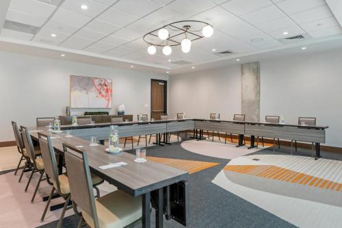 a conference room with a long table and chairs at Cambria Hotel Austin Downtown in Austin