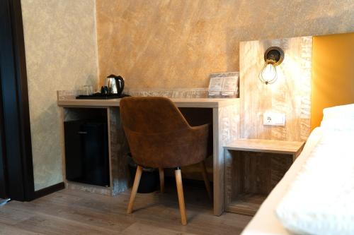 a chair sitting at a desk in a room at Haus Kärnten in Döbriach
