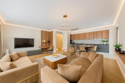 a living room with a couch and a table at ONE66 - Luxury Aparthotel in Braşov