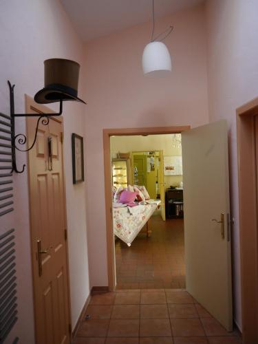 a hallway with a room with a bed and a light at Haus Honigstal Landhaus Café in Wuppertal