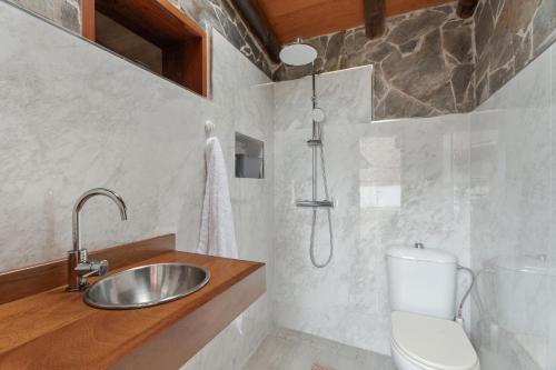 a bathroom with a sink and a toilet at Vista Teide in Tacoronte
