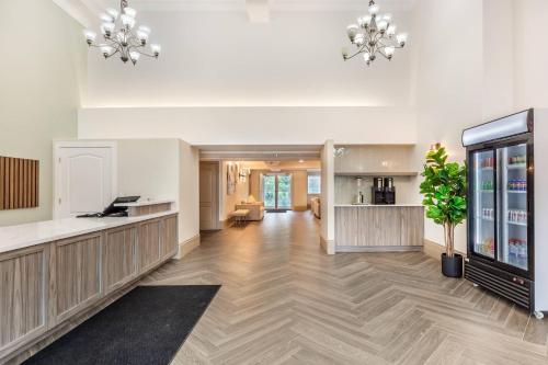 an empty lobby with a waiting room and a pharmacy at Velora Hinton, an Ascend Collection Hotel in Hinton