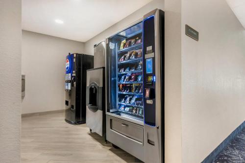 a vending machine in a building with drinks in it at Comfort Inn & Suites in Saint Louis
