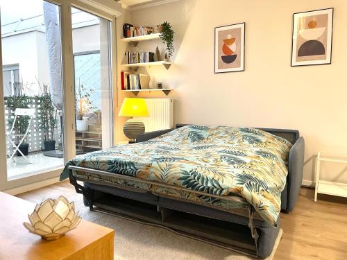 En eller flere senge i et værelse på Urban Nest - Paris - CDG - Parking & Confort