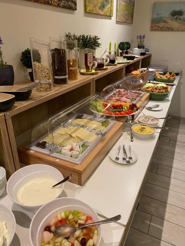 a buffet line with many different types of food at Landhaus Fillerberg in Wildeshausen