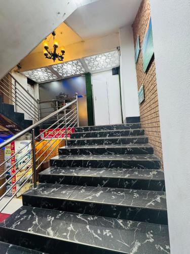 a set of stairs leading up to a building at Hotel Relax Inn Sylhet in Sylhet
