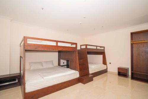 Ένα ή περισσότερα κρεβάτια σε δωμάτιο στο Grand Phan Thiet Hotel