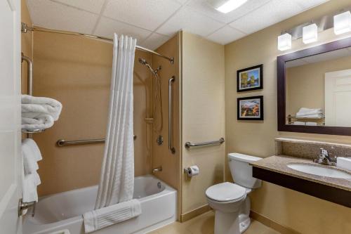 a bathroom with a shower and a toilet and a sink at Comfort Inn Rockland - Boston in Rockland