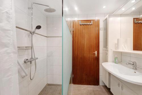 a bathroom with a shower and a sink at Ferienwohnung Zeller in Gaienhofen