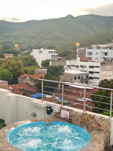 a swimming pool on the roof of a building at Aparta Suites La Flora- Infinity Living in Cali