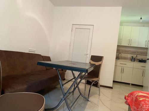 a living room with a table and a couch at BEATRIS in Ureki